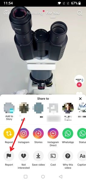 Pressing Report button in the TikTok mobile app. 