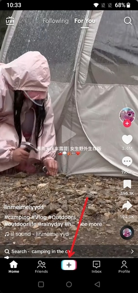 Pressing the "+" button in TikTok app. 
