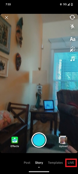 Tapping on LIVE option in TikTok app.