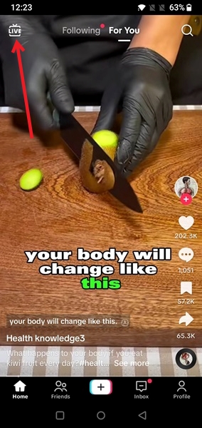 Tapping LIVE button in TikTok app.