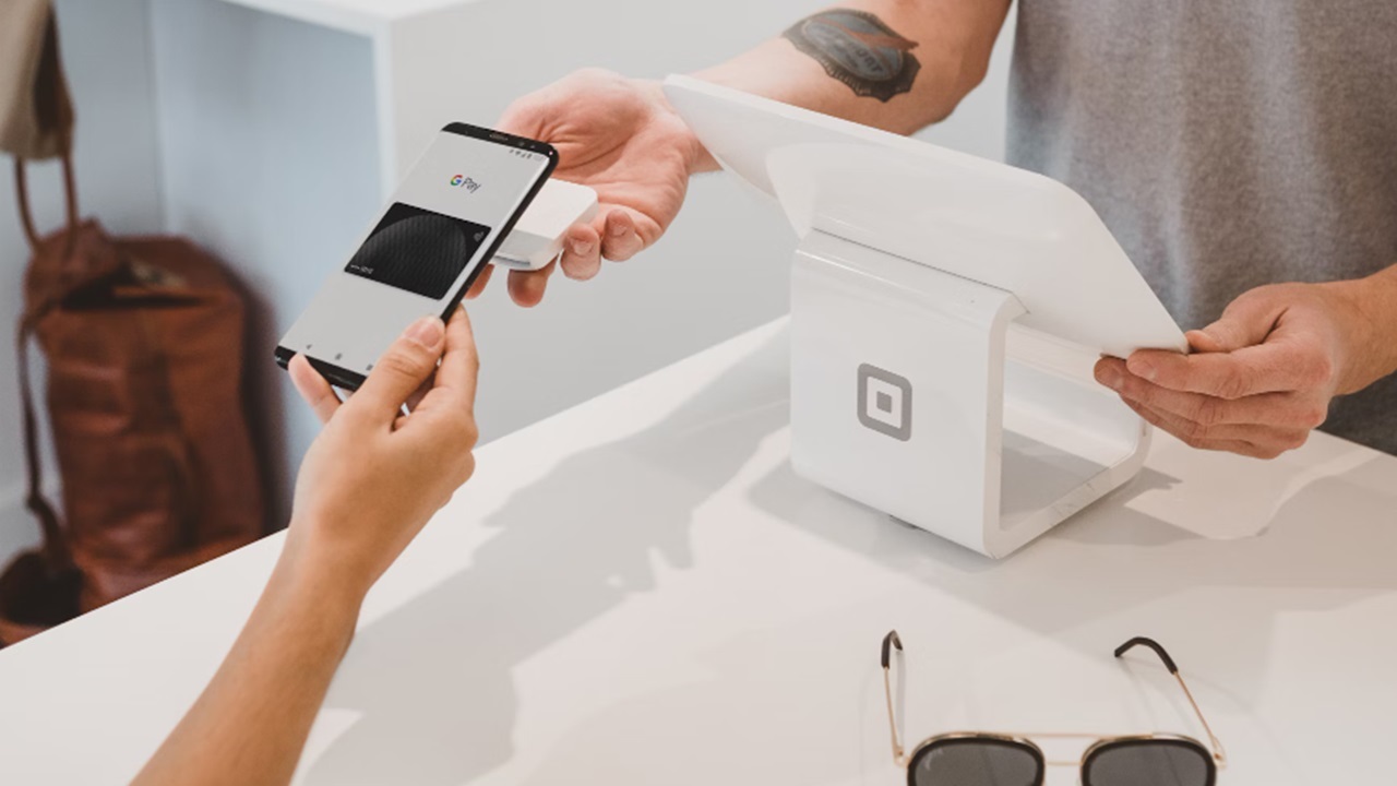 Person using Google Pay digital wallet for NFC mobile payments