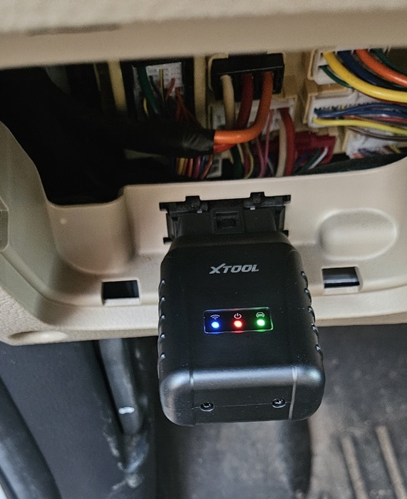 VCI box connected to OBD port in Kia.