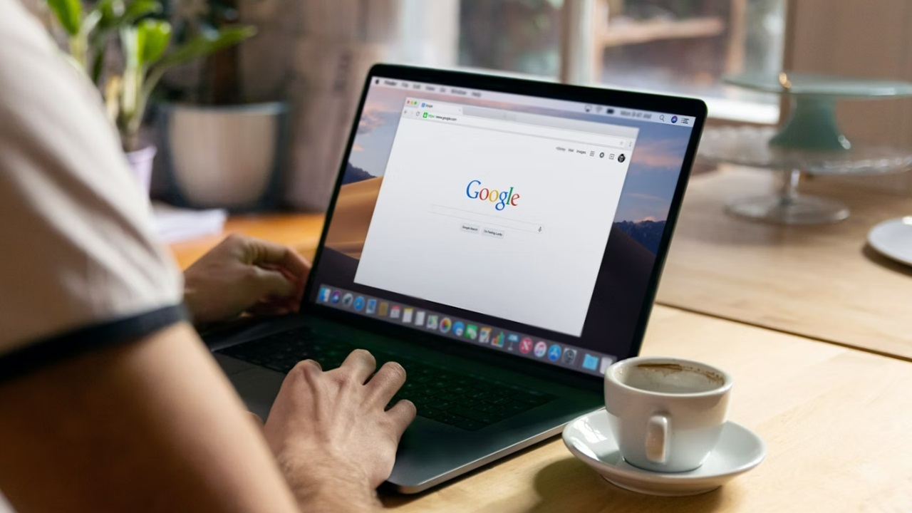 Person searching Google on their laptop.