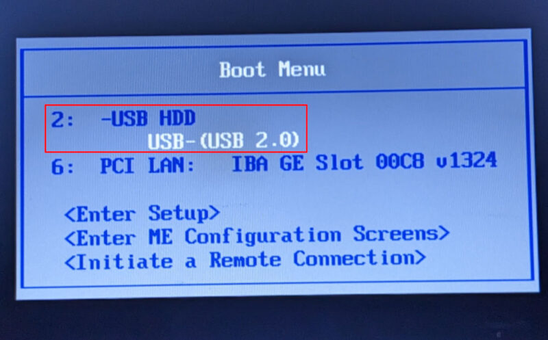 A photograph of a Lenovo ThinkPad's Boot Menu highlighting the Dynebolic USB stick.