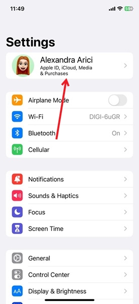 Tapping on Apple ID in iPhone Settings app.