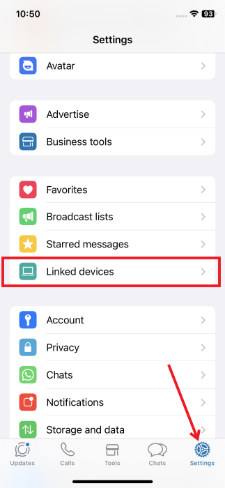 Tapping on "Linked devices" button in WhatsApp on iPhone.