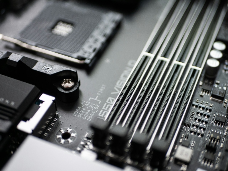 Close-up of a computer motherboard showing RAM slots