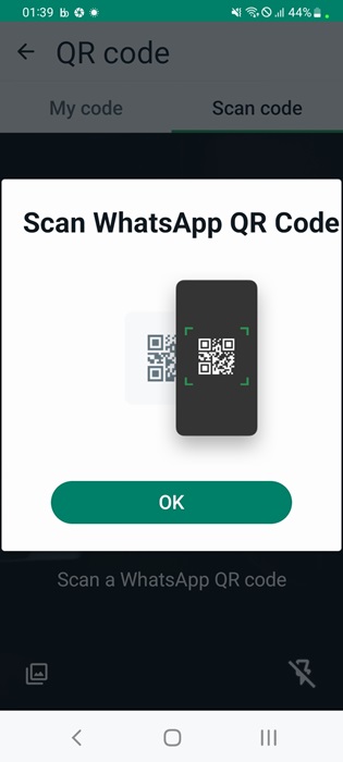 Scan WhatsApp QR code to save a new contact.