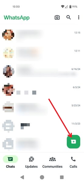 Tapping on the new chat button in WhatsApp on Android.