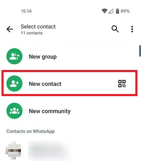 Selecting "New contact" option in WhatsApp on Android.