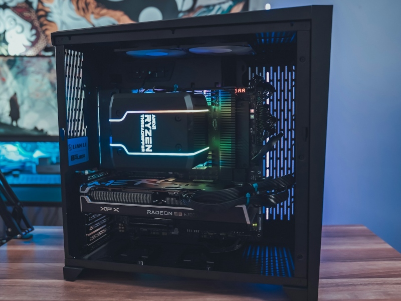 A black gaming PC with an AMD Ryzen CPU cooler and AMD graphics card