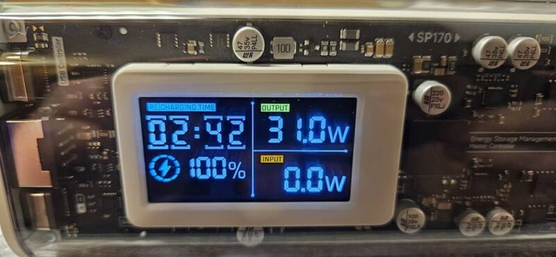 Shargeek Power Bank with display showing 100% charged.