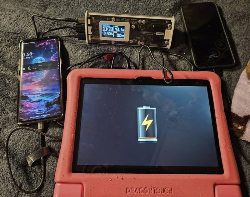 Charging two phones and a tablet with the Shargeek 170 power bank.