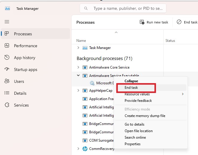 Ending the antimalware service executable task in Task Manager.