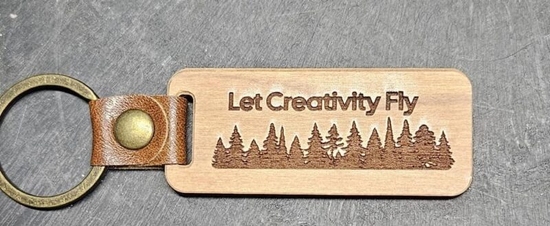 Engraving a walnut keychain.