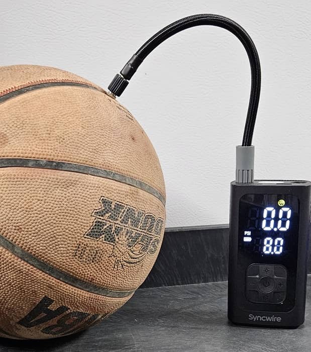 Tire inflator with a basketball.