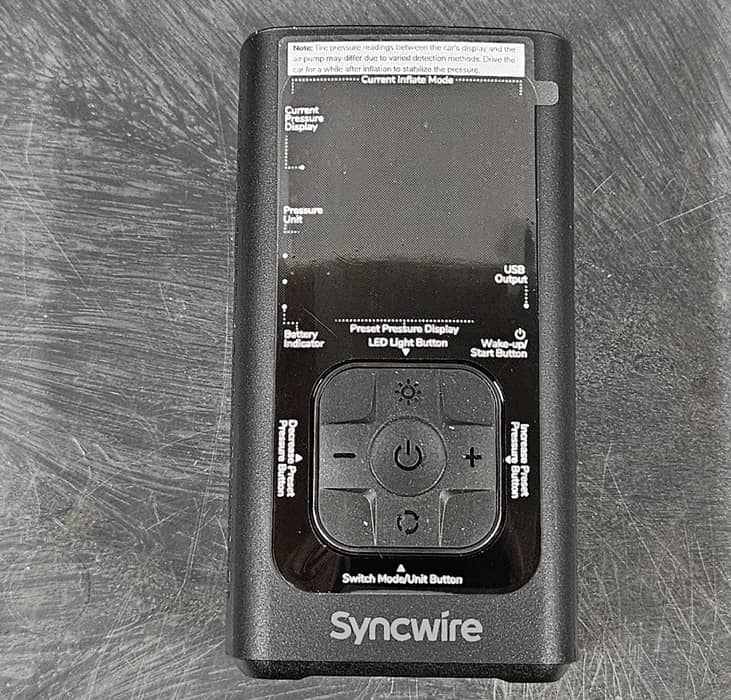 Syncwire tire inflator with static cling instructions.
