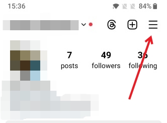 Tapping on hamburger menu in Instagram profile.