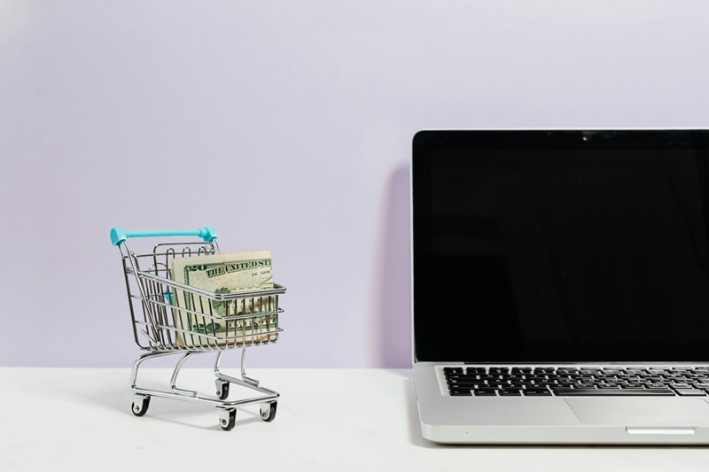 Shopping online using laptop. 