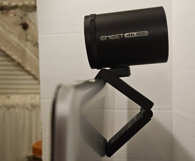 EMEET webcam clipped onto laptop.