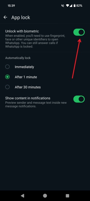 Turning on the "Unlock with biometric"' option in WhatsApp.