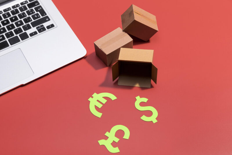 tiny shipped packages near a laptop