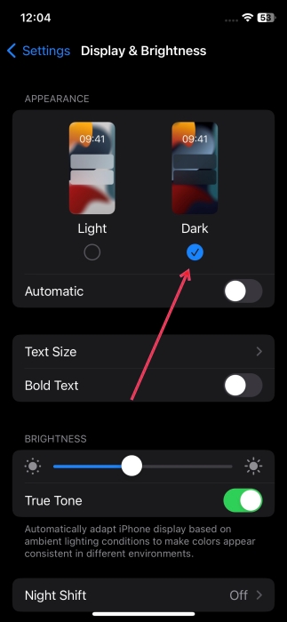 Switching to dark mode in iPhone Settings.