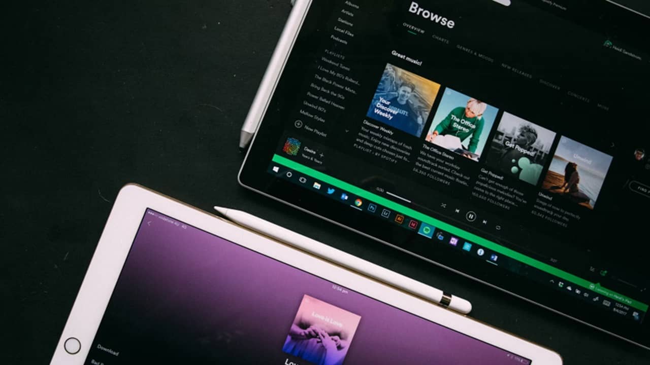 Spotify on two tablets.