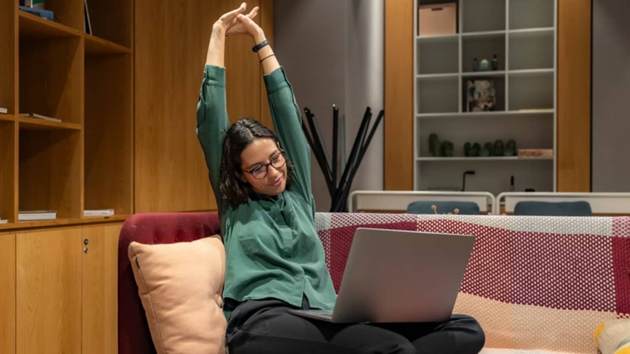 Woman stretching after scheduling tasks with Windows Task Scheduler