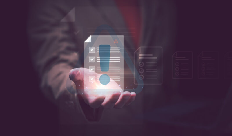 hand with a list of points on a digital paper