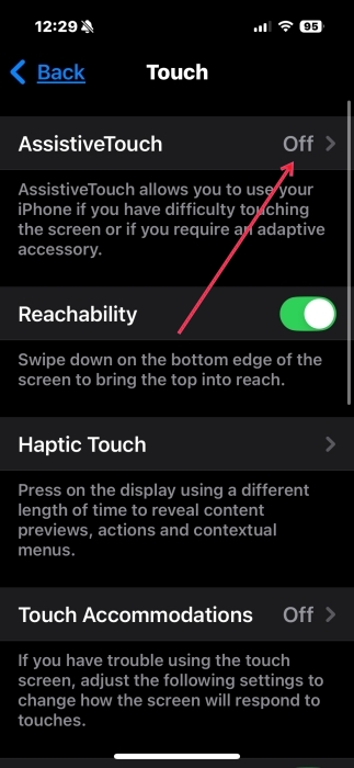 Toggling on AssistiveTouch option in iPhone Settings. 