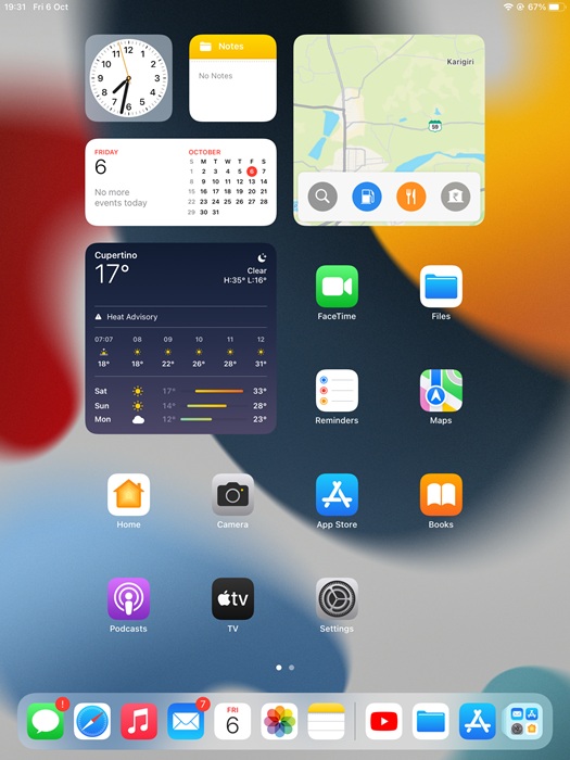 iPad homescreen with all Apple apps displayed.
