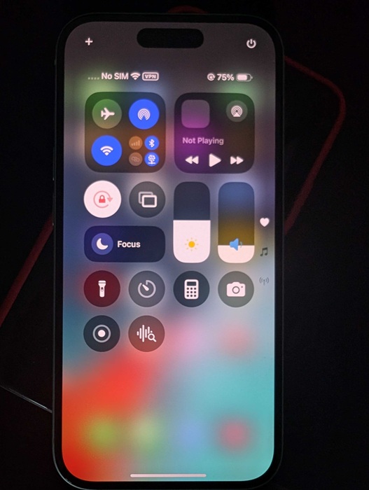 iPhone Control Center with Wi-Fi, Bluetooth, Airplane mode and other icons.