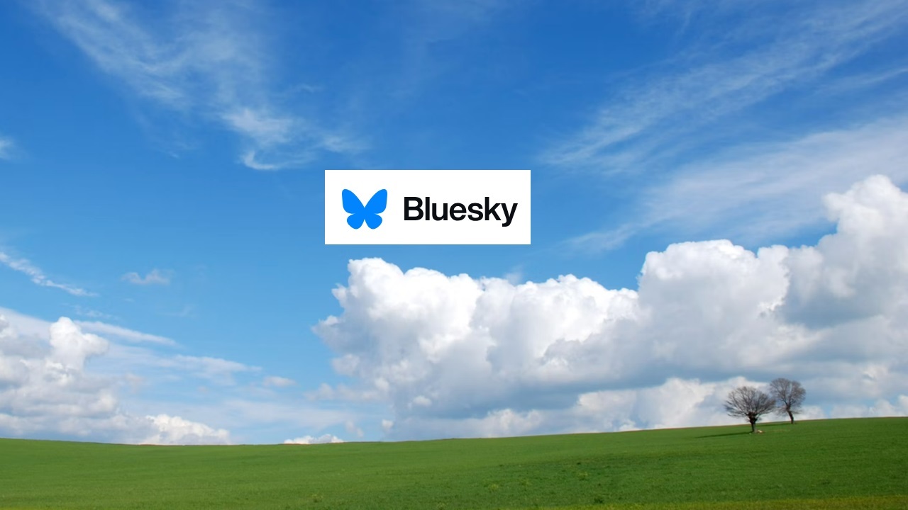 A blue sky over green grass with the Bluesky logo.