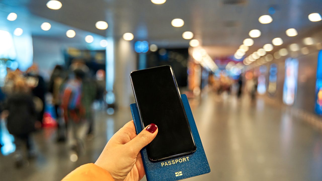 Woman with Physical and Digital Passport in Google Wallet