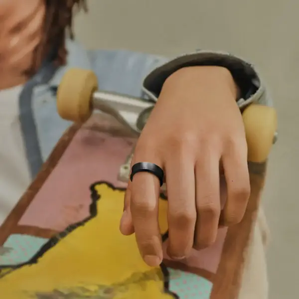 Samsung Galaxy Ring shown on hand.
