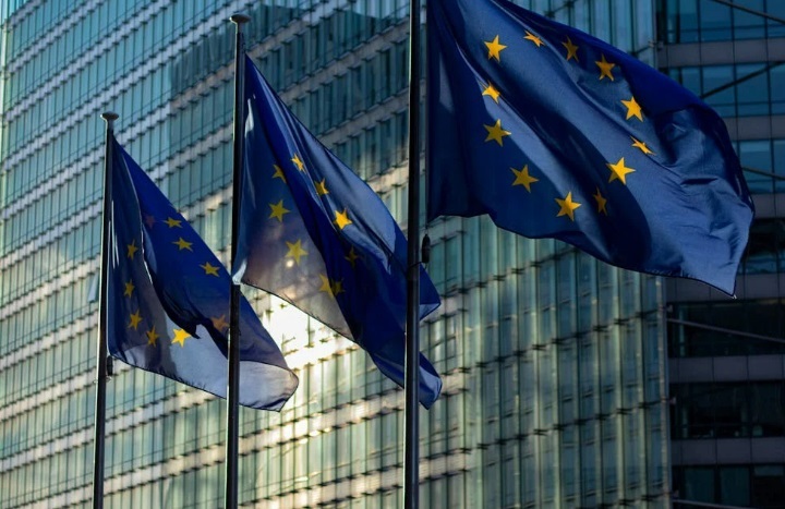 European Commission building and flags.
