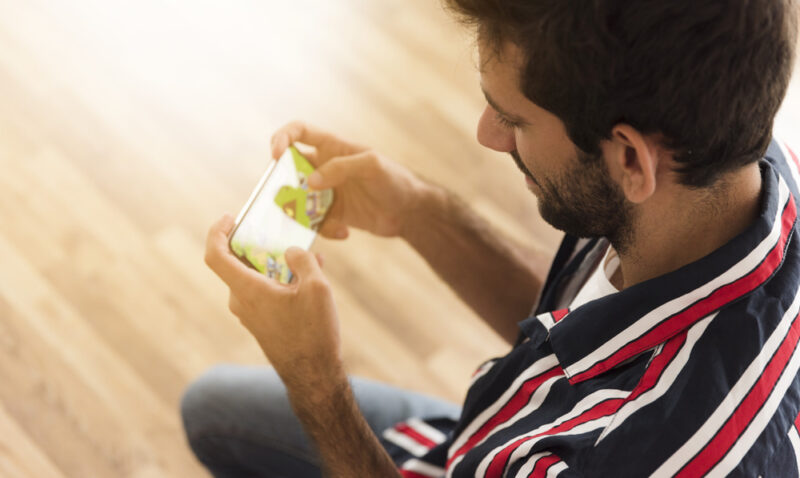 man playing a game on phone