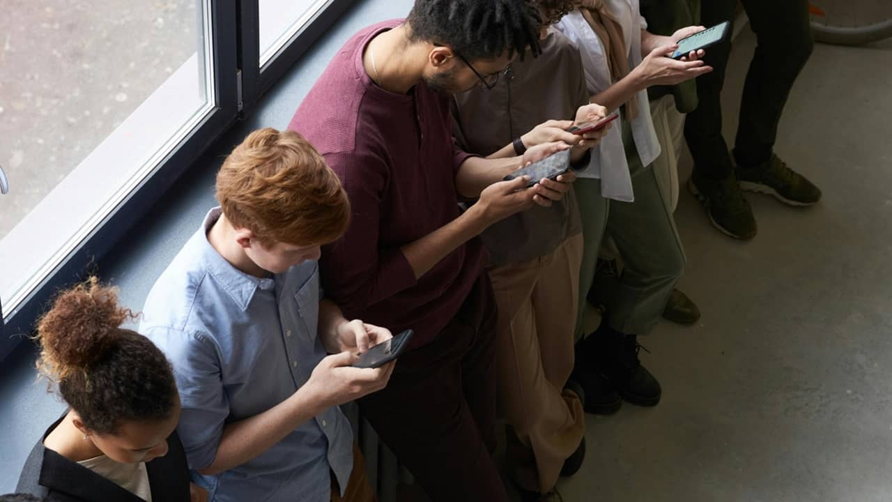 Group of people texting.