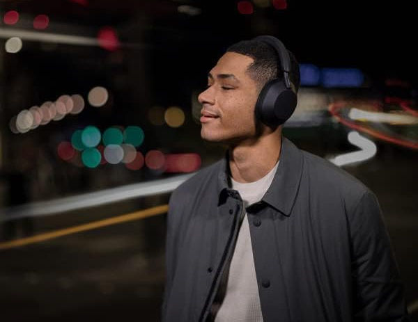Person Wearing Sony Wh 1000xm5 Headphones