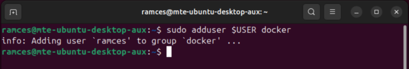 A terminal showing the process of adding the current user to the Docker group.