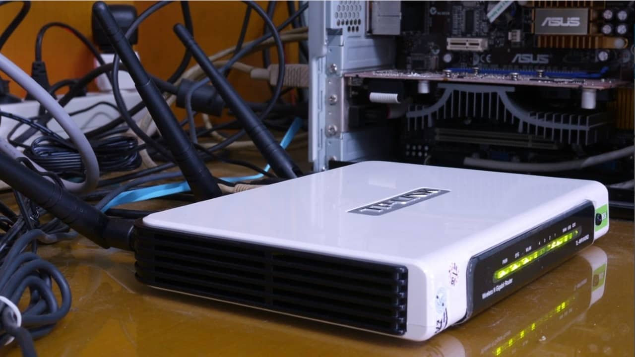 TP-Link router next to PC.