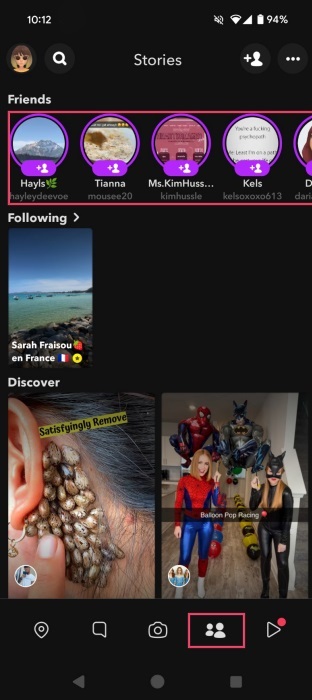 Switching to the Stories tab in Snapchat app. 