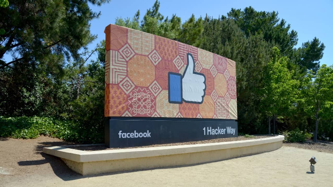 Facebook logo and address.