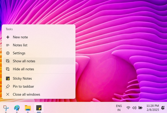 Using the taskbar to "Show/hide all notes" for the Sticky Notes app.