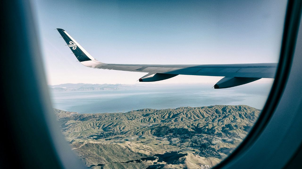 A photo of a plane flying over a landscape