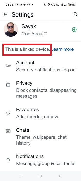 "This is a Linked Device" status on a device indicating WhatsApp Companion Mode.