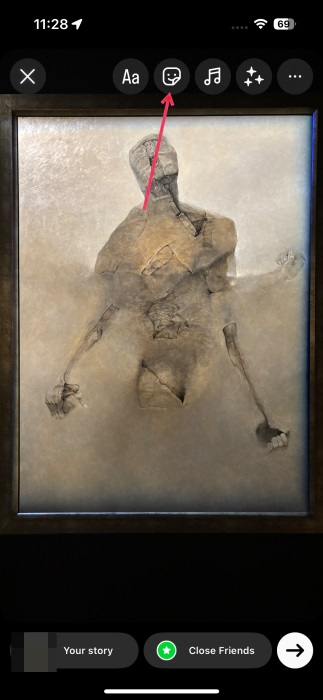 Tapping on sticker icon in Instagram story creation screen. 