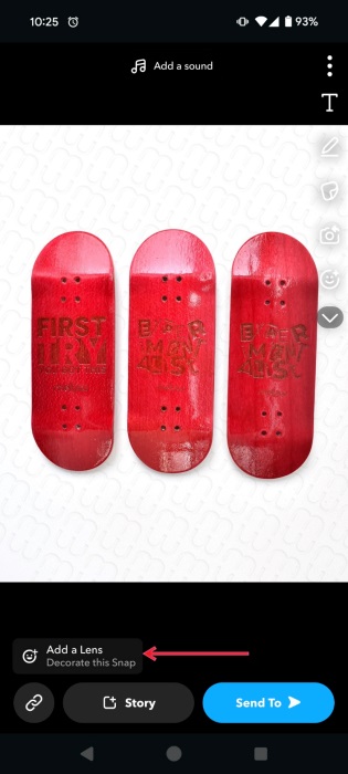 Tapping "Add a Lens" option in Snapchat snap creation screen. 