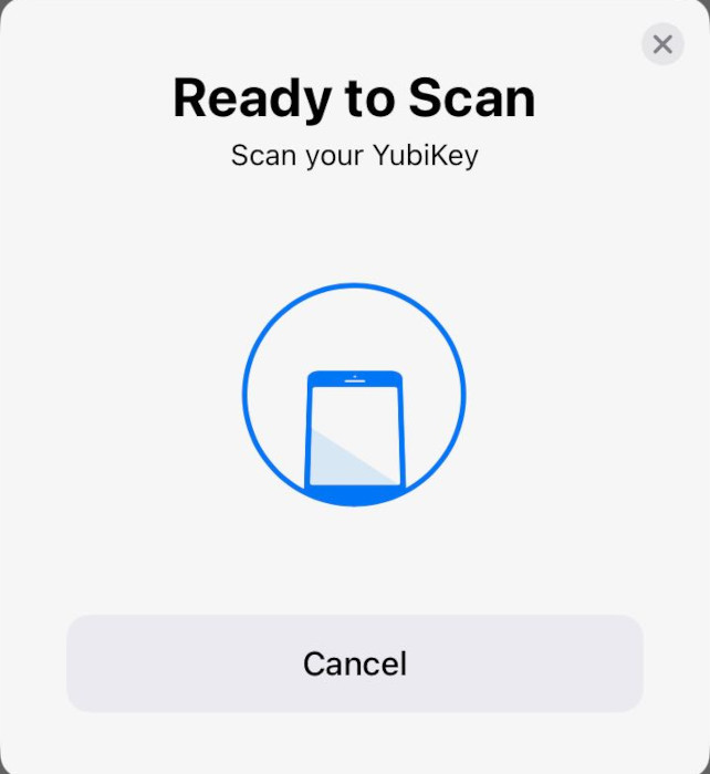 A screenshot showing the NFC scan prompt for a Yubikey in iOS.